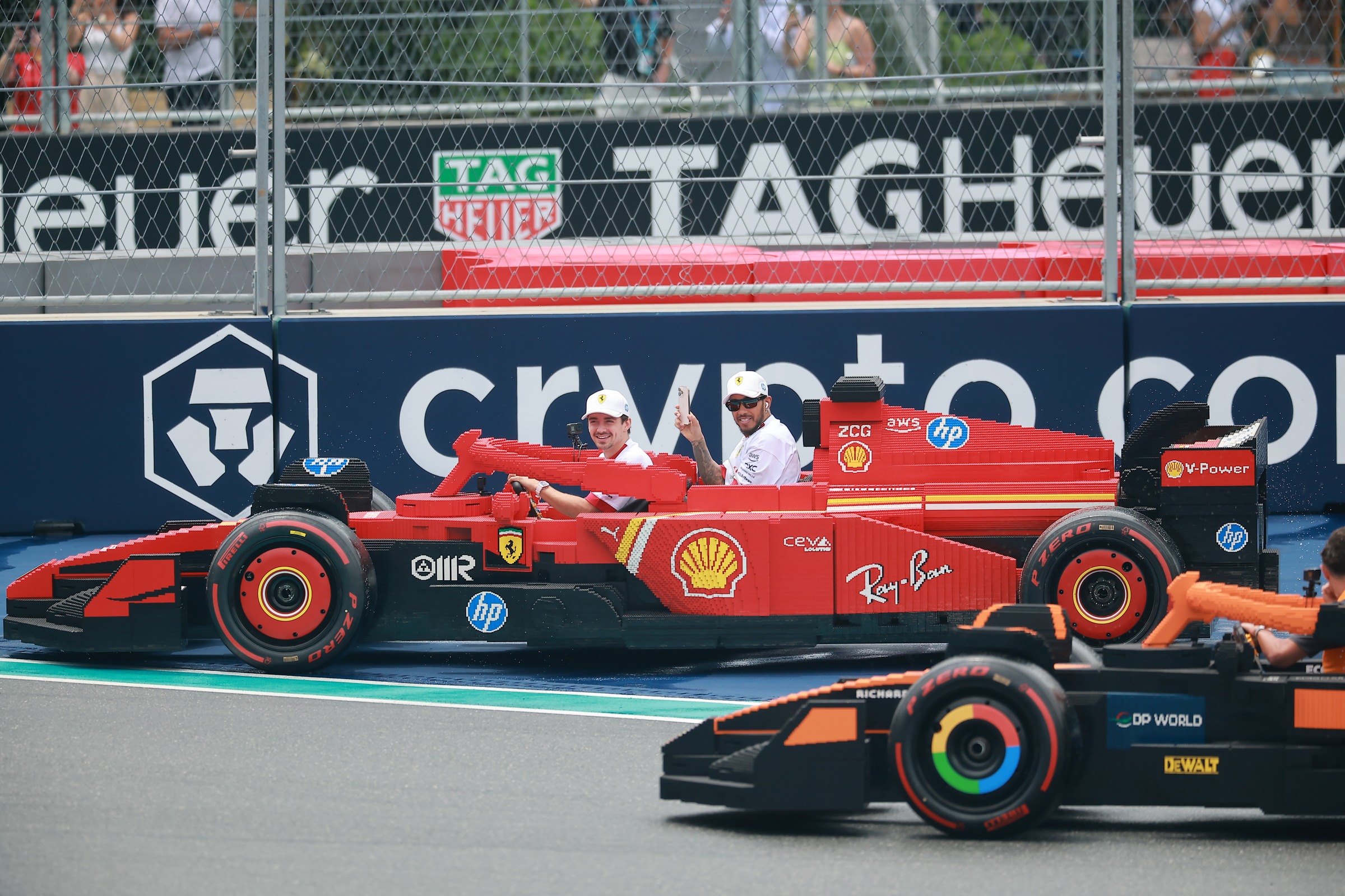 Charles Leclerc and Lewis Hamilton in a driveable LEGO Ferrari during the 2025 Miami Grand Prix drivers’ parade
