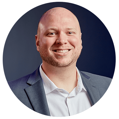 Michael Howard, founder and CEO of Nichefire, wearing a blue jacket and white shirt.